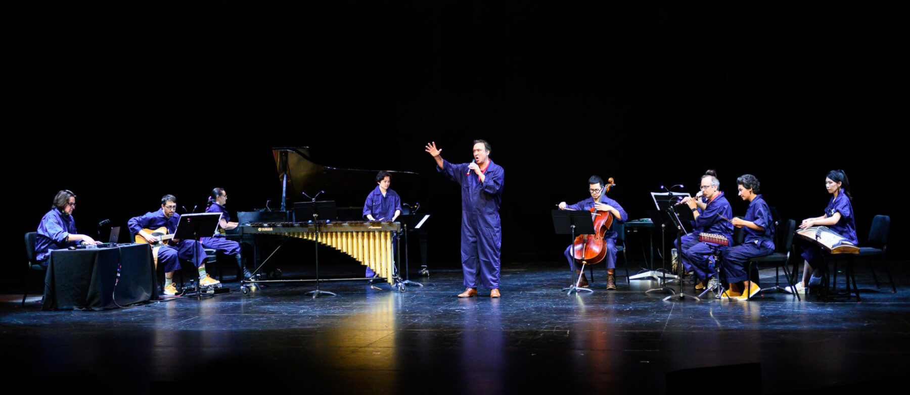 The whole Tempest Project Company performing on stage.